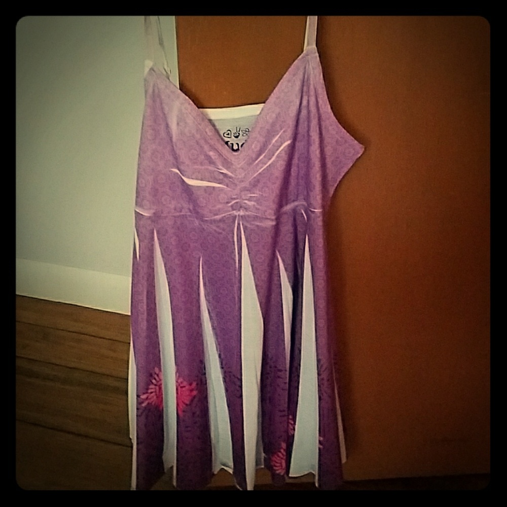 Tank top. Flows out from under chest. Light feel.